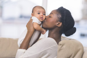 Babies love faces and different expressions - show them as many as you can and see their reactions