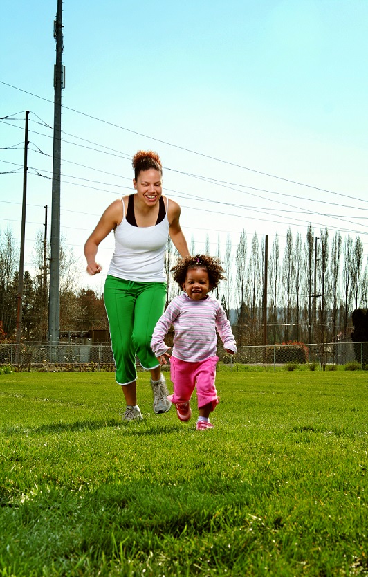 Mother-and-Daughter-Running-Through-Park